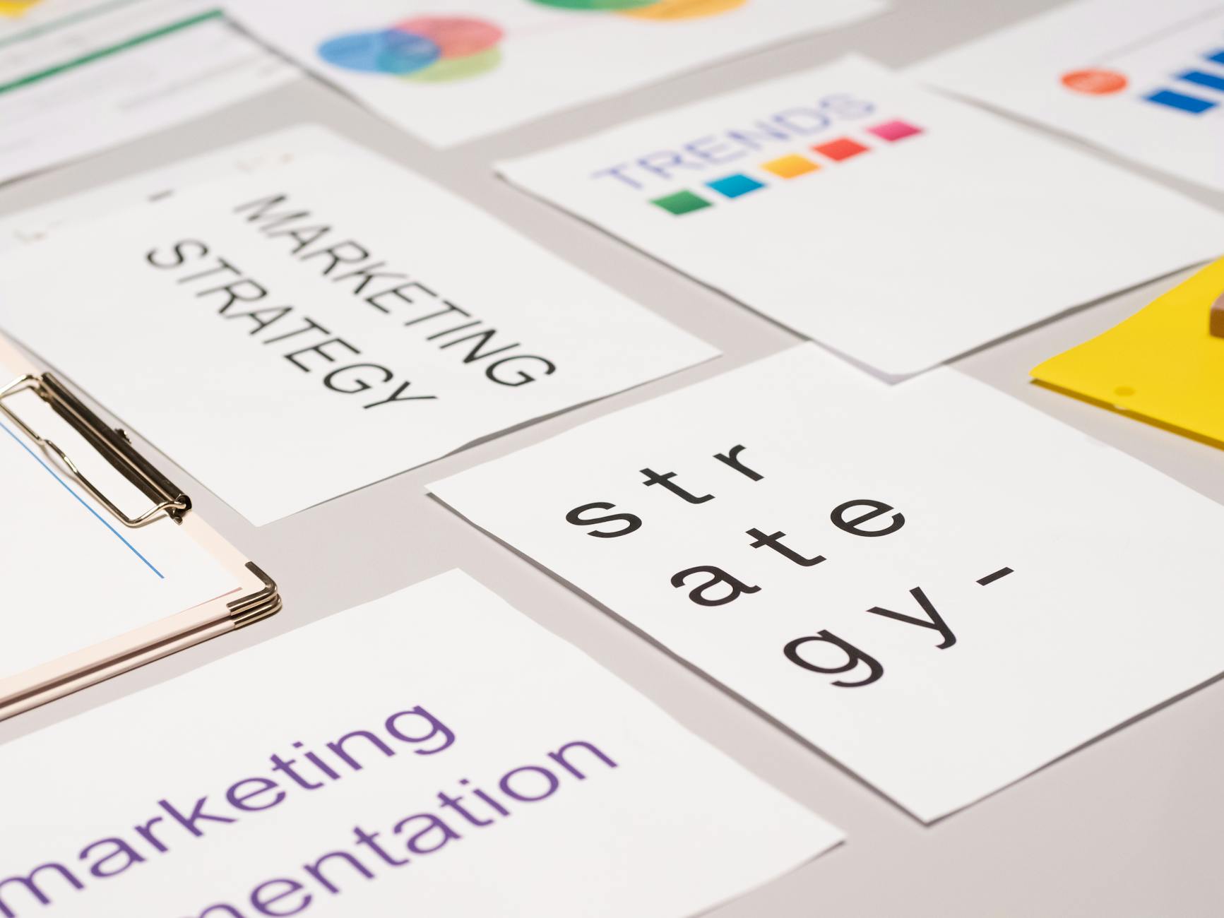https://www.pexels.com/photo/paper-cards-about-marketing-on-desk-7688430/